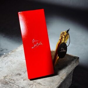 Christian Louboutin Red and Gold Silky Satin Lipstick- shade 001 Rouge Louboutin